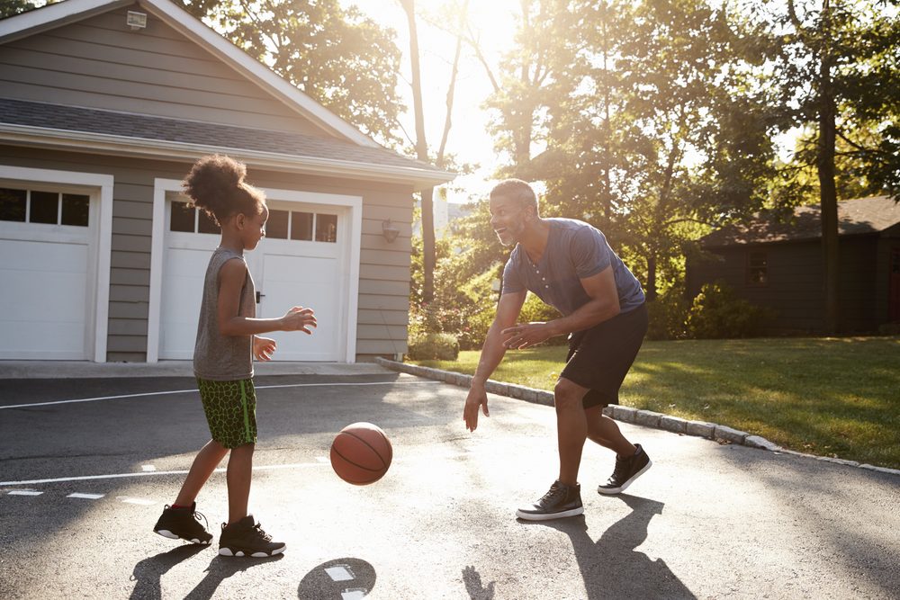 father daughter playing basketball